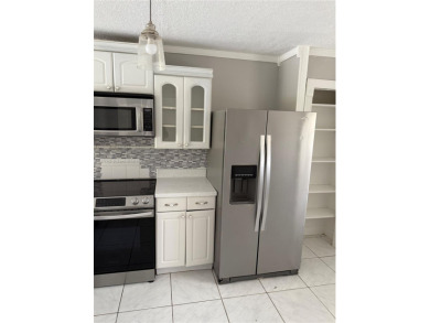 This spacious 2 bedroom condo, is securely located in a gated