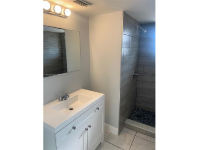 This spacious 2 bedroom condo, is securely located in a gated