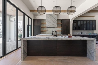 TIMELESS LUXURY & COASTAL SPLENDOR! On 1.33 acres overlooking