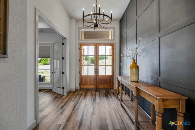 Situated on nearly 5 private acres in the prestigious Mystic