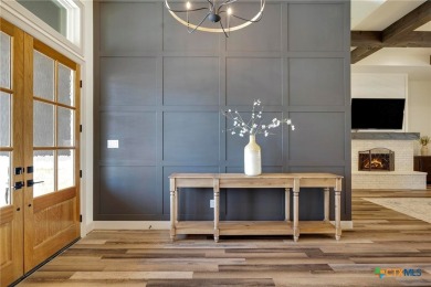 Situated on nearly 5 private acres in the prestigious Mystic