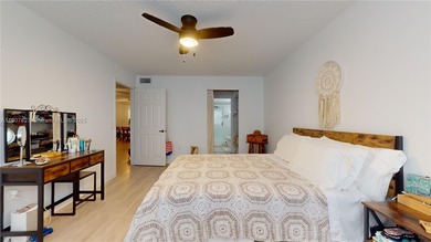 Immaculate 1st-floor unit in HOPA verified 55+ community. This