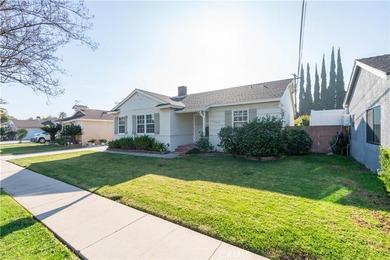 This beautiful home is nestled on a picturesque tree lined