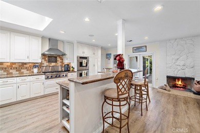 Spectacular single-level split-wing home featuring 4 bedrooms