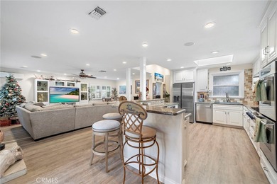 Spectacular single-level split-wing home featuring 4 bedrooms