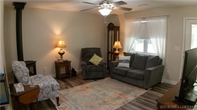 ABSOLUTELY STUNNING lake home right off of Hwy UU and just 3.4