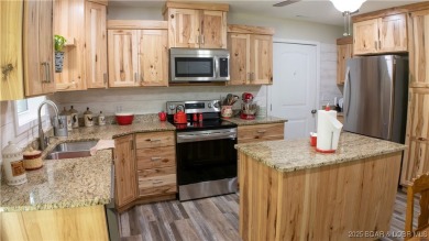 ABSOLUTELY STUNNING lake home right off of Hwy UU and just 3.4