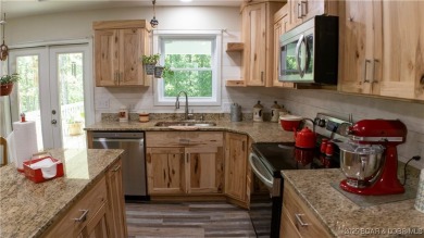 ABSOLUTELY STUNNING lake home right off of Hwy UU and just 3.4