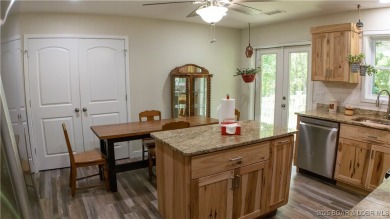 ABSOLUTELY STUNNING lake home right off of Hwy UU and just 3.4