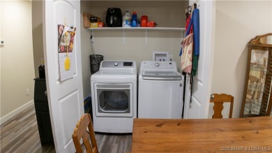 ABSOLUTELY STUNNING lake home right off of Hwy UU and just 3.4