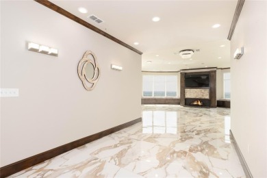 Experience luxury high-rise living in this stunning 4-bedroom