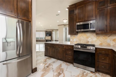 Experience luxury high-rise living in this stunning 4-bedroom