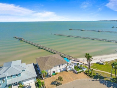 Tucked behind the gates of Sea Shell Shores, lies a home of