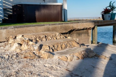 Tucked behind the gates of Sea Shell Shores, lies a home of