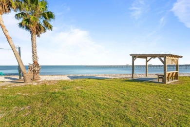 Tucked behind the gates of Sea Shell Shores, lies a home of