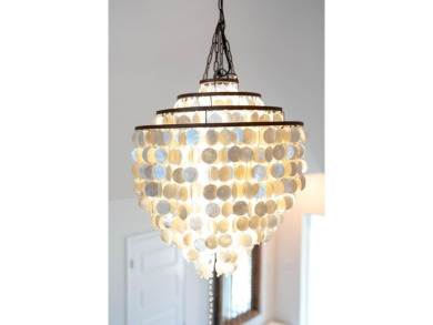 Tucked behind the gates of Sea Shell Shores, lies a home of