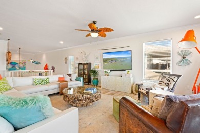 Tucked behind the gates of Sea Shell Shores, lies a home of