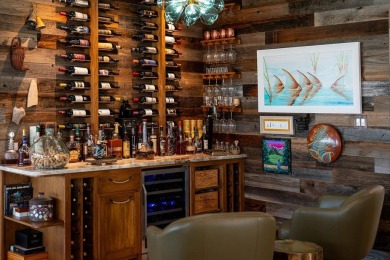 Tucked behind the gates of Sea Shell Shores, lies a home of