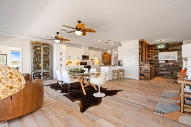 Tucked behind the gates of Sea Shell Shores, lies a home of