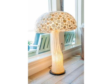 Tucked behind the gates of Sea Shell Shores, lies a home of