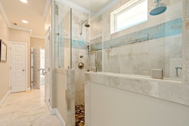 Tucked behind the gates of Sea Shell Shores, lies a home of