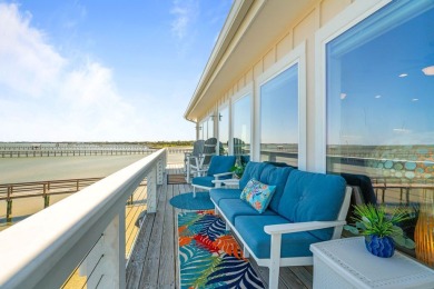 Tucked behind the gates of Sea Shell Shores, lies a home of