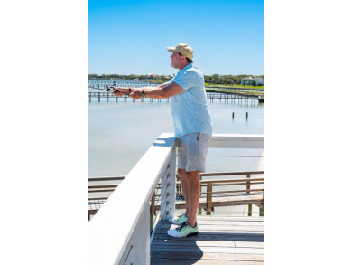 Tucked behind the gates of Sea Shell Shores, lies a home of