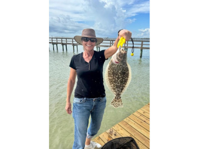 Tucked behind the gates of Sea Shell Shores, lies a home of