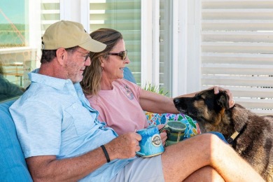 Tucked behind the gates of Sea Shell Shores, lies a home of