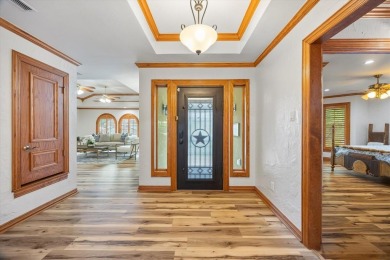 Nestled in the exclusive Lakeside Village community, this