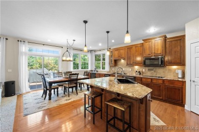 Immaculate home in a highly sought-after subdivision with lake