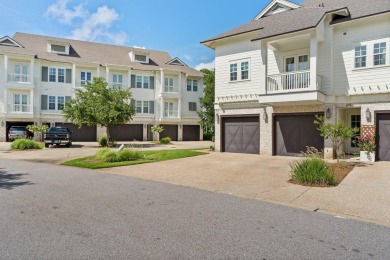 Welcome to refined coastal living in this exquisite end-unit