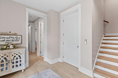 Welcome to refined coastal living in this exquisite end-unit