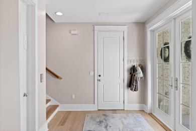 Welcome to refined coastal living in this exquisite end-unit