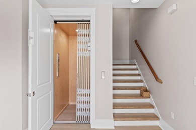 Welcome to refined coastal living in this exquisite end-unit