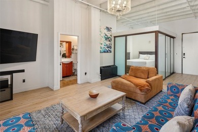 Welcome to this stunning high ceiling loft on the ninth floor of