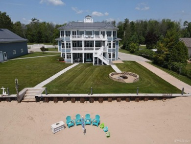 Welcome to the most exquisite Waterfront Home on Lake Michigan's