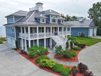 Welcome to the most exquisite Waterfront Home on Lake Michigan's