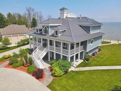 Welcome to the most exquisite Waterfront Home on Lake Michigan's