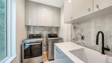 Discover unparalleled modern living at this custom contemporary