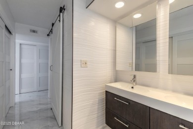 Experience elevated coastal living in this beautifully appointed