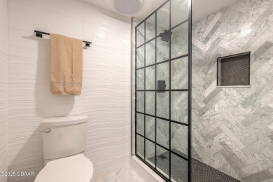 Experience elevated coastal living in this beautifully appointed