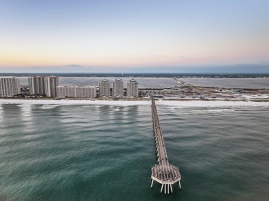 Set on Navarre Beach's iconic shoreline, Unit 105 at The Inn at