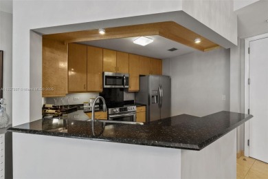 Experience the privacy and charm of Brickell Key in this 1 bed /