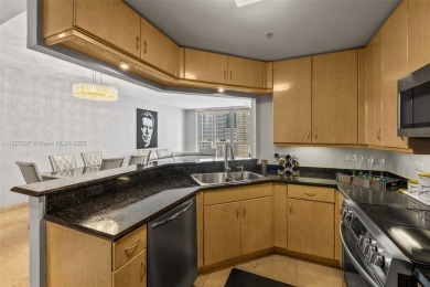 Experience the privacy and charm of Brickell Key in this 1 bed /