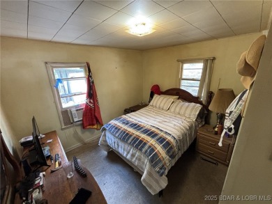 Start your Lake of the Ozarks adventure with this 1960 home full