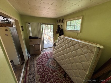 Start your Lake of the Ozarks adventure with this 1960 home full