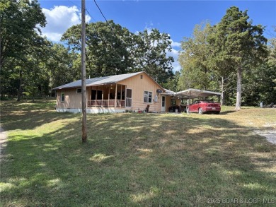 Start your Lake of the Ozarks adventure with this 1960 home full