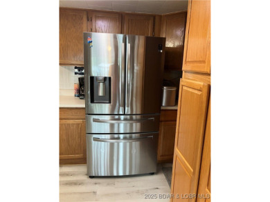 ***Huge PRICE REDUCTION*** Rare find *Level* Lakefront home sits