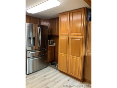 ***Huge PRICE REDUCTION*** Rare find *Level* Lakefront home sits